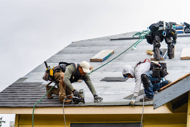 Professional Roofing technician working in East Meadow, NY